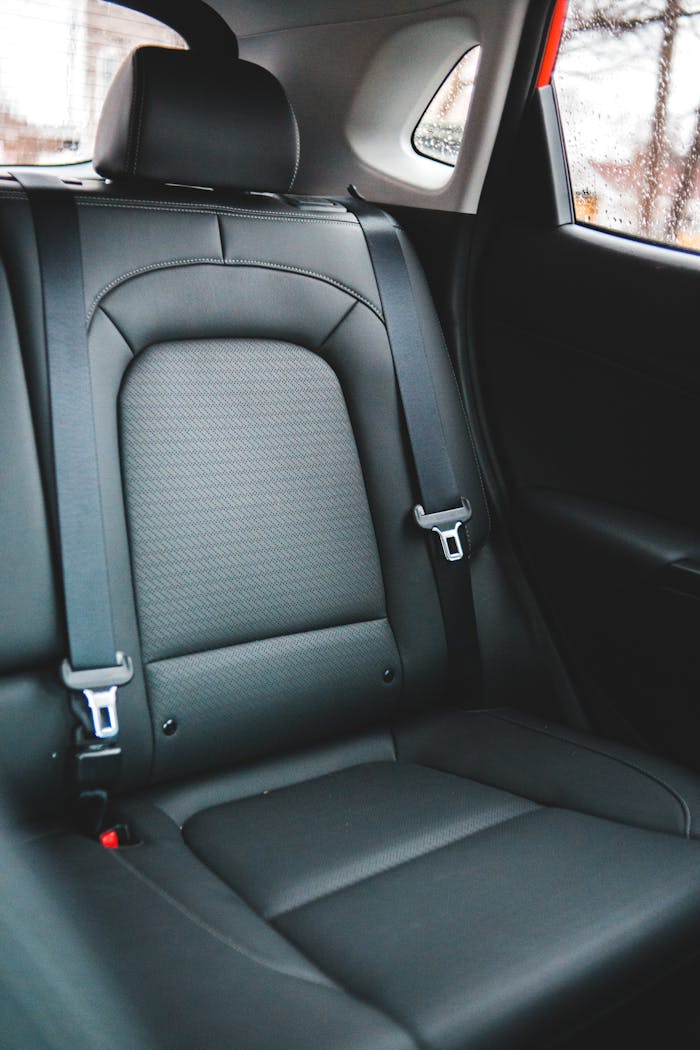 Elegant black leather car backseat showcasing modern automotive design and comfort.